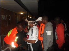 Spectators being searched before entering the stadium